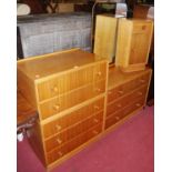 1960s G-Plan oak and walnut bedroom furniture, to include mirrorback dressing chest of three long