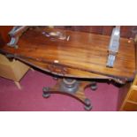 An early Victorian rosewood round cornered hall table, the frieze carved with a stag and tree in