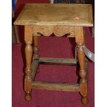 An early 20th century joined oak joint stool, raised on turned and square cut supports united by