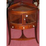 A 19th century mahogany ledgeback double door glazed corner washstand, having single drawer