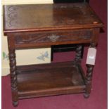 A circa 1900 oak floral line carved single drawer two-tier side table, raised on barleytwist