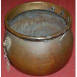 A Victorian brass cauldron, having lion mask ring handles, h.32cm