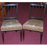 A set of four 19th century mahogany dining chairs, having stuffover padseats