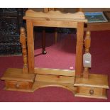 A modern pine swing dressing table mirror, having two lower drawers, w.87cm