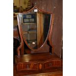 A 19th century mahogany and boxwood strung shield shaped swing dressing table mirror, raised on