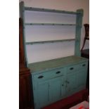 A Victorian and later painted pine kitchen dresser, having three-tier open plate rack over base