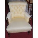 A Victorian mahogany and cream herringbone fabric upholstered buttonback tub armchair, raised on