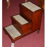 A Victorian mahogany step commode, having hinged compartments, raised on turned supports, length