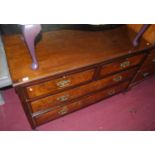 An Edwardian walnut low chest, of two short over two long drawers, on castors, w.121cm