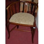 An Edwardian mahogany and boxwood strung tub elbow chair, having a fixed padseat, w.55.5cm