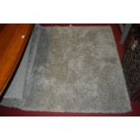 A contemporary grey coloured shag-pile rug