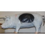 A contemporary painted fibreglass model of a standing pig, length 95cm