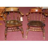 An early 20th century elm tub captain's chair; together with one other similar elm and beech example