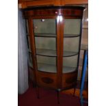 An Edwardian mahogany and boxwood strung demi-lune single door glazed china display cabinet, h.