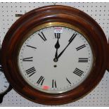A contemporary mahogany circular wall clock, having single winding hole, with pendulum and key,