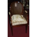 A circa 1900 mahogany and satinwood strung double split cane tub armchair, w.56cm