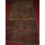 A Persian woollen red ground hall runner, having all-over floral geometric decoration, with some