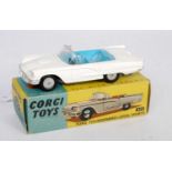 A Corgi Toys No. 215 Ford Thunderbird open sports car, comprising white body with blue interior