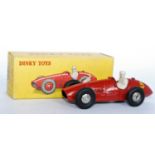 A French Dinky Toys No,23J Ferrari F1 race car, comprising red body with spun hubs and racing No. 5,