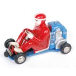 A Schuco No.1035 Micro-Racer go-cart, comprising of blue and silver body with red clothed driver