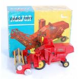 A Corgi Toys No. 1111 Massey Ferguson 780 combine harvester comprising red body with yellow cast