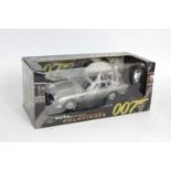 An Auto Art 1/18 scale model of a James Bond Goldfinger Aston Martin DB5 in the original window box,