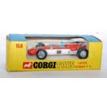 A Corgi Toys No. 158 Lotus Climax F1 race car comprising of orange and white body with blue driver