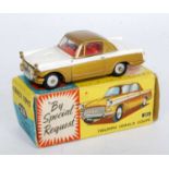 A Corgi Toys No. 231 Triumph Herald Coupe, comprising of gold and white body with red interior and