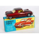 A Corgi Toys No. 259 Le Dandy Coupe comprising metallic dark maroon body with yellow interior and