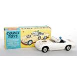 A Corgi Toys No. 318 Lotus Elan S2 comprising of white body with racing No. 5 driver figure, black