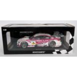 A Minichamps No. 132216 1/18 scale model of a BMW M3DTM 2013 BMW Team RMG DTM race car as driven