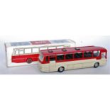 A Tekno No. 950 Mercedes Benz 0302 public transport bus comprising of cream and red body with