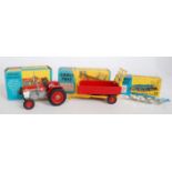 A Corgi Toys boxed tractor and farm implement diecast group to include a No. 66 Massey Ferguson