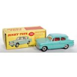 A Dinky Toys No. 155 Ford Anglia comprising of light blue body with red interior and spun hubs,