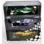A Minichamps and Hot Wheels Racing 1/18 scale boxed F1 diecast group to include a Minichamps