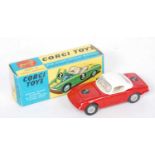 A Corgi Toys No.319 Lotus Elan hardtop Coupe, comprising of red body with white roof and white