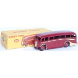 A Dinky Toys No. 281 Luxury coach comprising maroon body with cream side flashes and red hubs,
