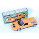 A Schuco plastic and electric operated model of a Mercedes C111 racing car, finished in orange and