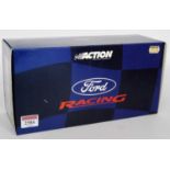 An Action Performance Racing 1/18 scale model of a Ford Focus WRC2000 race car finished in red, blue