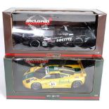 A UT Models and Minichamps 1/18 scale boxed Maclaren diecast group to include a Pauls Model Art