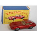 A Matchbox Regular Wheels No. 32B Jaguar E-type comprising of metallic red body with clear windows