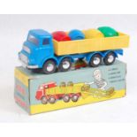 A Jimson No. 129 friction powered plastic barrel delivery truck comprising blue and yellow body with