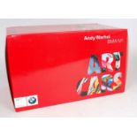 A Minichamps BMW Art Car Museum edition 1/18 scale model of an Andy Warhol BMW N1 M1 appears as