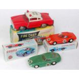 Three various boxed tinplate and plastic friction drive saloons to include a Chinese No. MF714