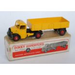A Dinky Toys No. 521 Bedford articulated lorry comprising black and yellow body with red hubs,