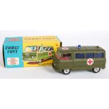 A Corgi Toys No. 354 Military Ambulance comprising of green body with red interior and blue glazing,