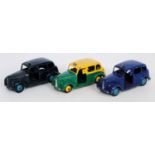 Three various loose Dinky Toy taxis to include Austin Taxi finished in green and yellow, a No. 40H