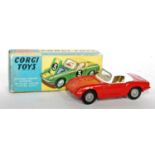 A Corgi Toys No. 319 Lotus Elan coupé comprising of red body with white roof and off-white