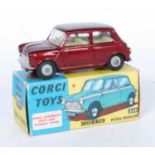 A Corgi Toys No.226 Morris Mini-Minor, comprising of dark metallic red body with lemon interior