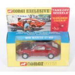 A Corgi Toys No.341 Mini Marcos GT850, comprising of metallic red body with cast hubs and off-